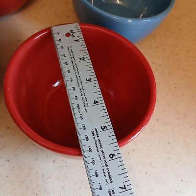 6 deep @Home red and blue kitchen bowls with a lidded storage canister