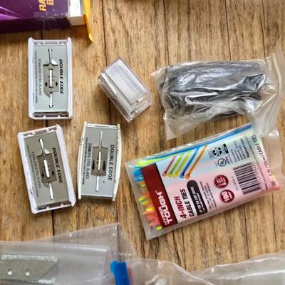 Assortment of homehardware - timers - zip ties - floor pads for furniture legs - and more