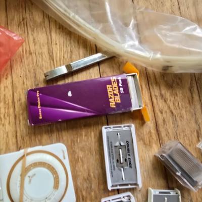Assortment of homehardware - timers - zip ties - floor pads for furniture legs - and more