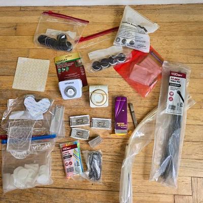 Assortment of homehardware - timers - zip ties - floor pads for furniture legs - and more