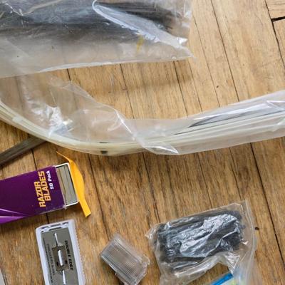 Assortment of homehardware - timers - zip ties - floor pads for furniture legs - and more