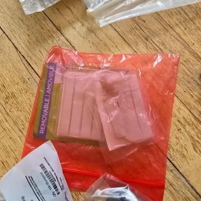 Assortment of homehardware - timers - zip ties - floor pads for furniture legs - and more