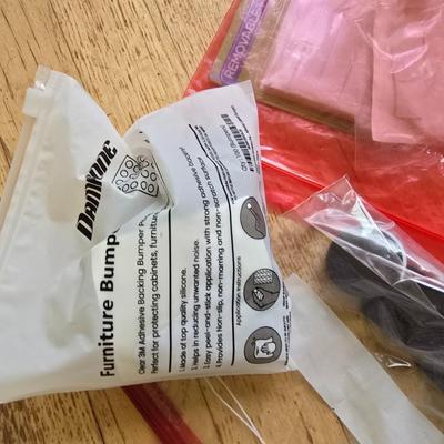 Assortment of homehardware - timers - zip ties - floor pads for furniture legs - and more