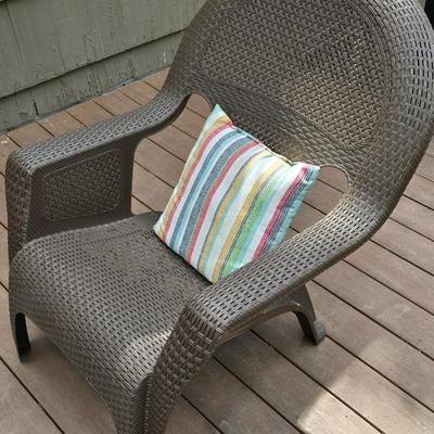 Faux wicker woven patio chair with outdoor throw pillow