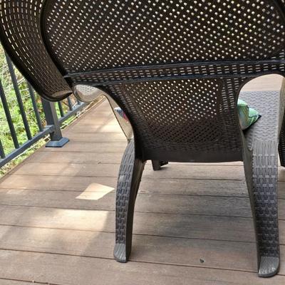 Faux wicker woven patio chair with outdoor throw pillow