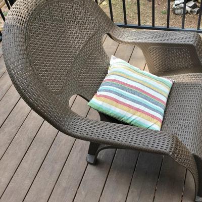Faux wicker woven patio chair with outdoor throw pillow