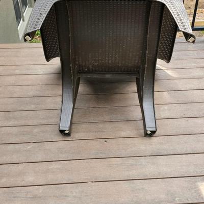 Faux wicker woven patio chair with outdoor throw pillow