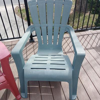 Three plastic Stackable Adirondack Chairs and a outdoor pillow - Keter chair