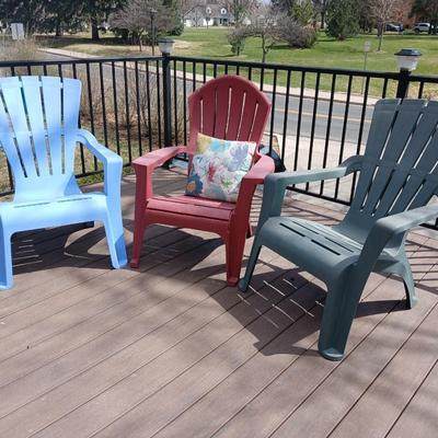 Three plastic Stackable Adirondack Chairs and a outdoor pillow - Keter chair