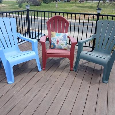 Three plastic Stackable Adirondack Chairs and a outdoor pillow - Keter chair