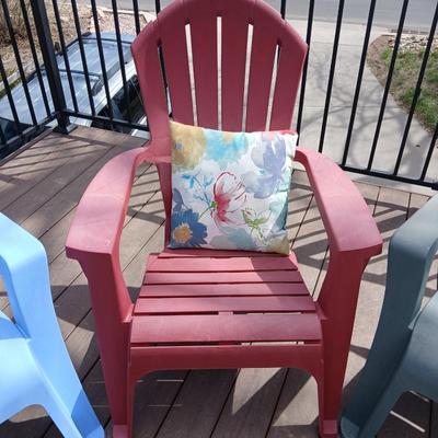 Three plastic Stackable Adirondack Chairs and a outdoor pillow - Keter chair