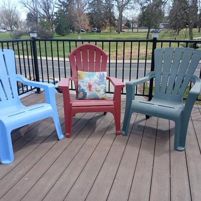 Three plastic Stackable Adirondack Chairs and a outdoor pillow - Keter chair