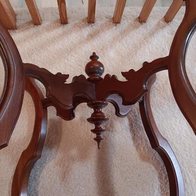 ANTIQUE PARLOR TABLE ON CASTERS AND A HEAVY CRYSTAL CUT LAMP