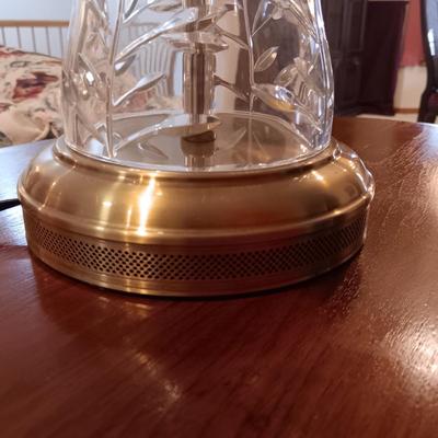 ANTIQUE PARLOR TABLE ON CASTERS AND A HEAVY CRYSTAL CUT LAMP