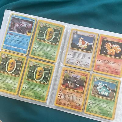 Binder of 100 Pokemon Cards, many Holos