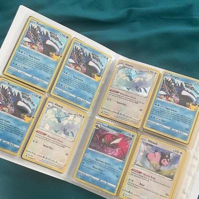 Binder of 100 Pokemon Cards, many Holos