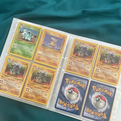 Binder of 100 Pokemon Cards, many Holos