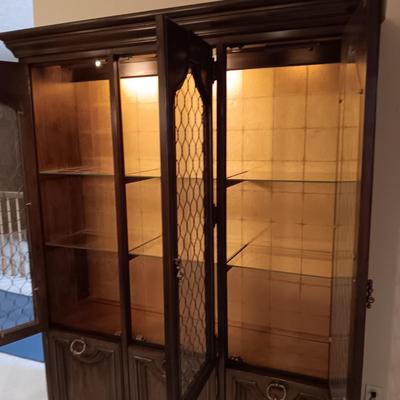 TRIPLE LIGHTED CHINA HUTCH W/3 DOORS ON TOP AND 3 ON THE BOTTOM PLUS 3 DRAWERS
