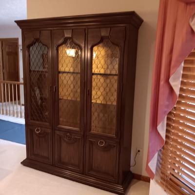 TRIPLE LIGHTED CHINA HUTCH W/3 DOORS ON TOP AND 3 ON THE BOTTOM PLUS 3 DRAWERS