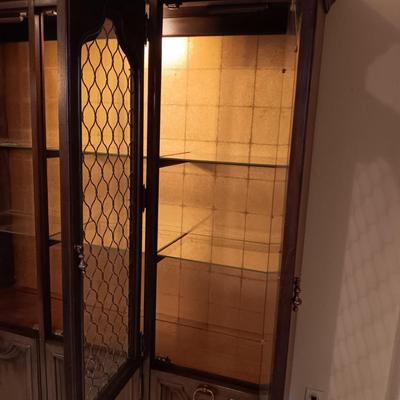TRIPLE LIGHTED CHINA HUTCH W/3 DOORS ON TOP AND 3 ON THE BOTTOM PLUS 3 DRAWERS