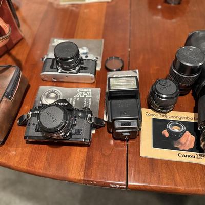 Lot of vintage Canon cameras and lens.
