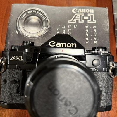 Lot of vintage Canon cameras and lens.