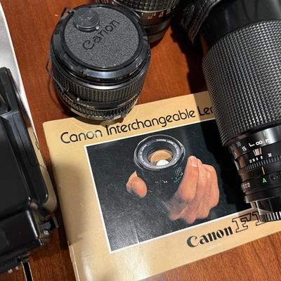 Lot of vintage Canon cameras and lens.