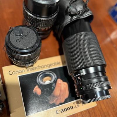 Lot of vintage Canon cameras and lens.