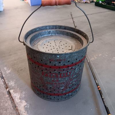 FALLS CITY GALVANIZED MINNOW PAIL AND A BERKLEY FISHING POLE W/REEL