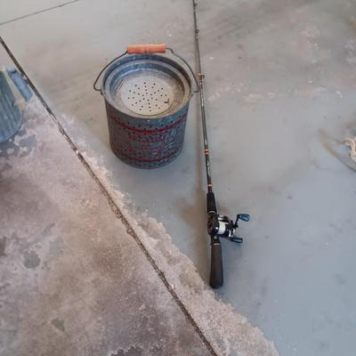 FALLS CITY GALVANIZED MINNOW PAIL AND A BERKLEY FISHING POLE W/REEL
