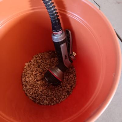 FLOWER POTS, GARDEN HOSE W/SPRAYER, PARTIAL BAG OF SOIL AND MORE