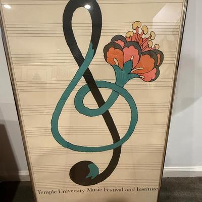 Two famed posters and one empty frame