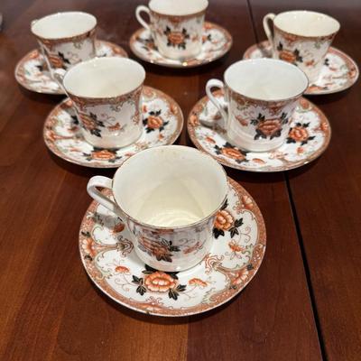 6 Asian style tea cups and saucers