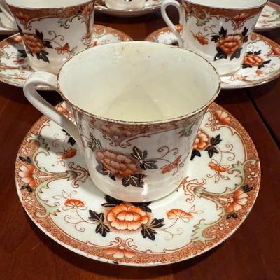 6 Asian style tea cups and saucers