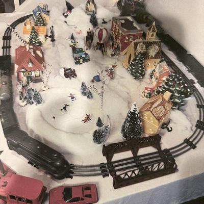 Train village with Lionel trains, houses and more!
