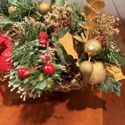 One candle decor and three faux flower arrangements