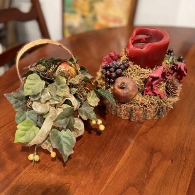 One candle decor and three faux flower arrangements