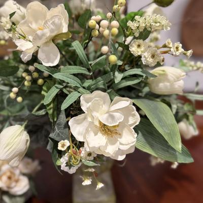 Two pretty white faux flower arrangements