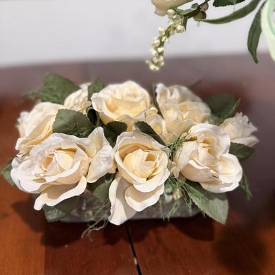 Two pretty white faux flower arrangements