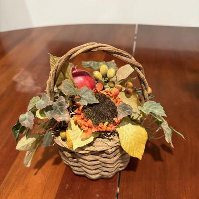 Two fall faux flower arrangements