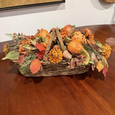 Two fall faux flower arrangements