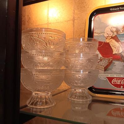 12 TIARA GLASS DESSERT PEDESTAL BOWLS AND A TIN COCA-COLA TRAY