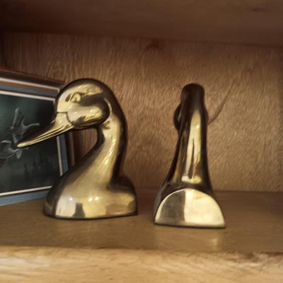 A PAIR OF BRASS DUCK HEAD BOOKENDS AN A PEWTER ELK