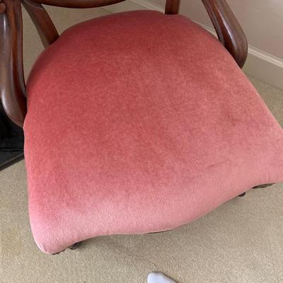 Pink side chair and fireplace tools