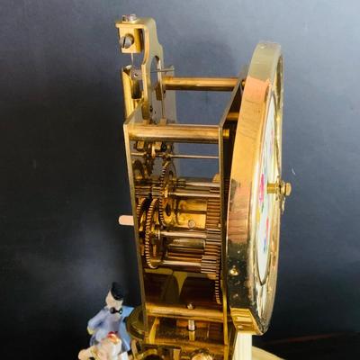 LOT 309: German Kern Anniversary Clock with Enamel Face and Base with Porcelain Figures and Vintage 8 Day Clock with German Figures on...