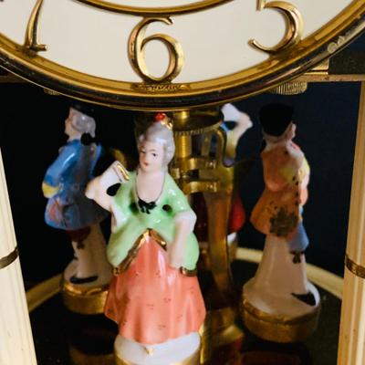 LOT 309: German Kern Anniversary Clock with Enamel Face and Base with Porcelain Figures and Vintage 8 Day Clock with German Figures on...