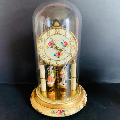 LOT 309: German Kern Anniversary Clock with Enamel Face and Base with Porcelain Figures and Vintage 8 Day Clock with German Figures on...