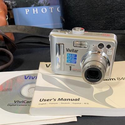 LOT 394: Assortment of Digital Cameras, Binoculars, Books and More