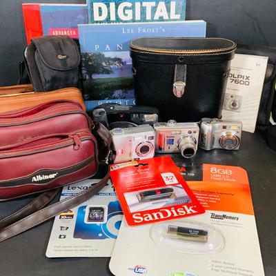 LOT 394: Assortment of Digital Cameras, Binoculars, Books and More