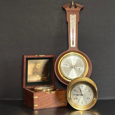 LOT 629: Brass Boston Ships Clock, C. Plath Hamburg Nautical Compass and Taylor Instruments Barometer